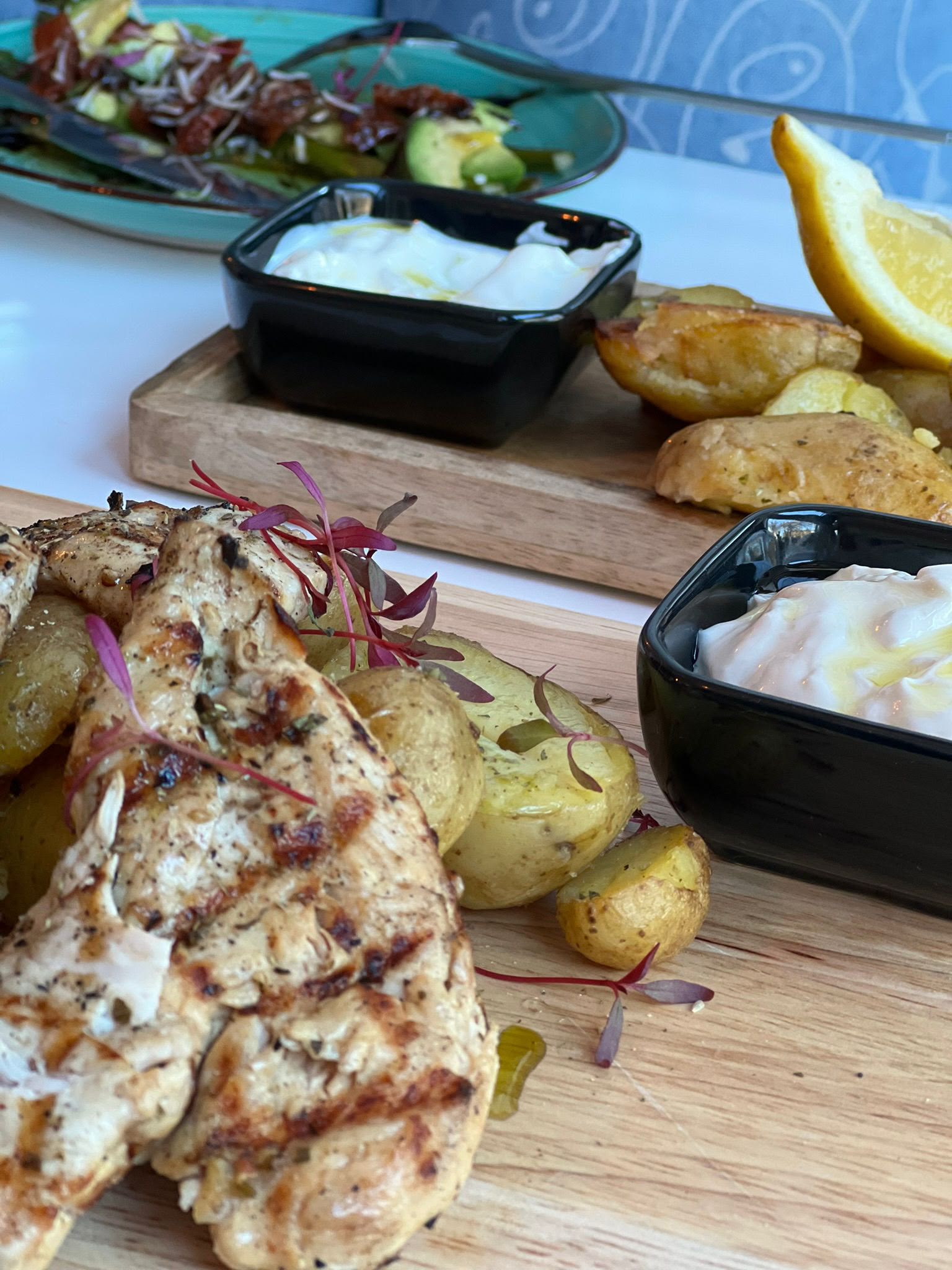 Restaurant grilled chicken and potatoes at Soleá