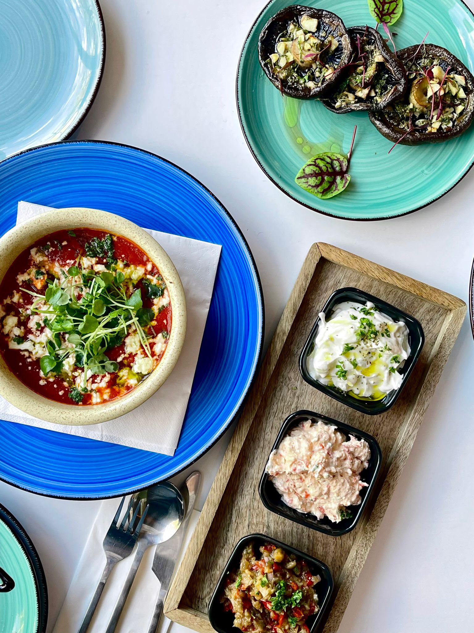 Restaurant sharing dishes and dips at Soleá